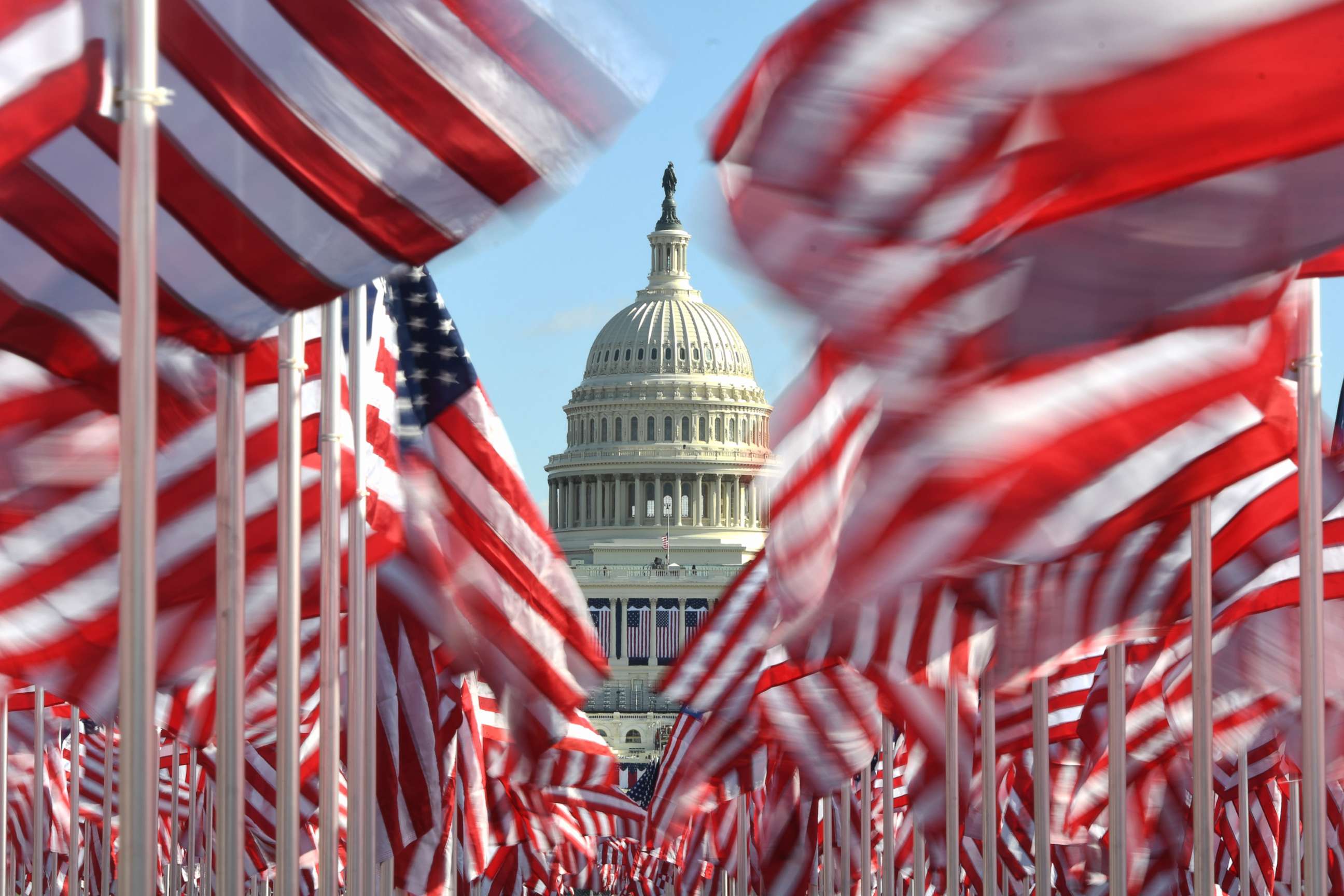 PHOTO: The dome of the U.S. Capitol is seen through rows of American flags placed on the National Mall, Jan. 19, 2021, in Washington, D.C.