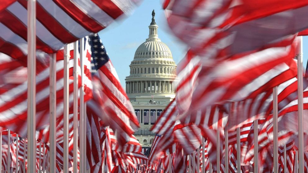 PHOTO: The dome of the U.S. Capitol is seen through rows of American flags placed on the National Mall, Jan. 19, 2021, in Washington, D.C.