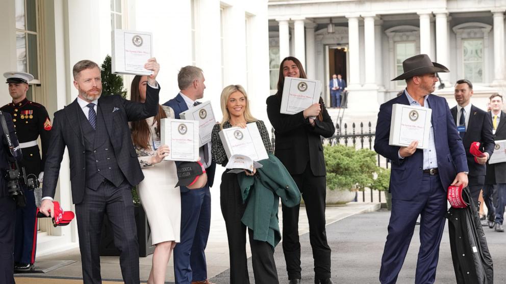PHOTO: People carrying binders with information on the to-be-declassified Epstein Files outside the West Wing Lobby of the White House on Feb. 27, 2024, in Washington, D.C.