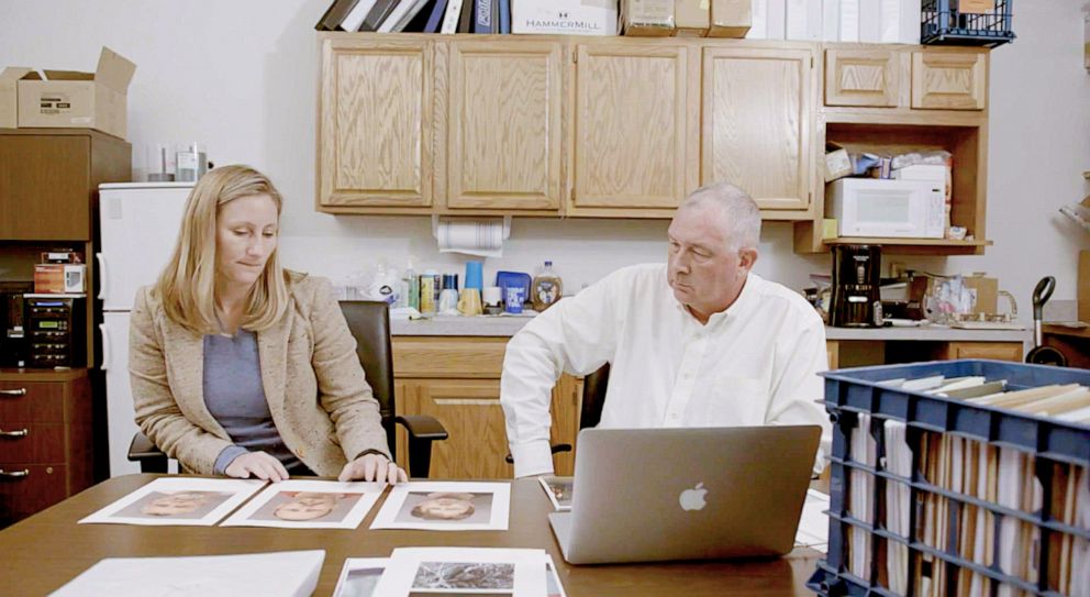 PHOTO: Agent Amy Kuhn and her former partner, Robin Smith, look through evidence from the "Crusaders" case, inside the FBI's office in Garden City, Kan., October 2020.