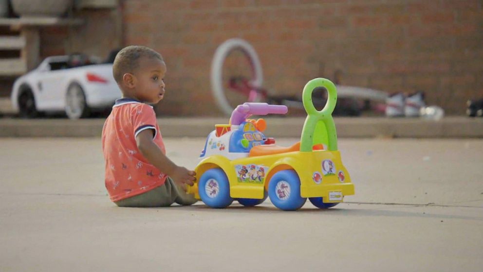 PHOTO: A boy plays near the apartment complex at 312 West Mary Street in Garden City, Kansas, summer 2021.