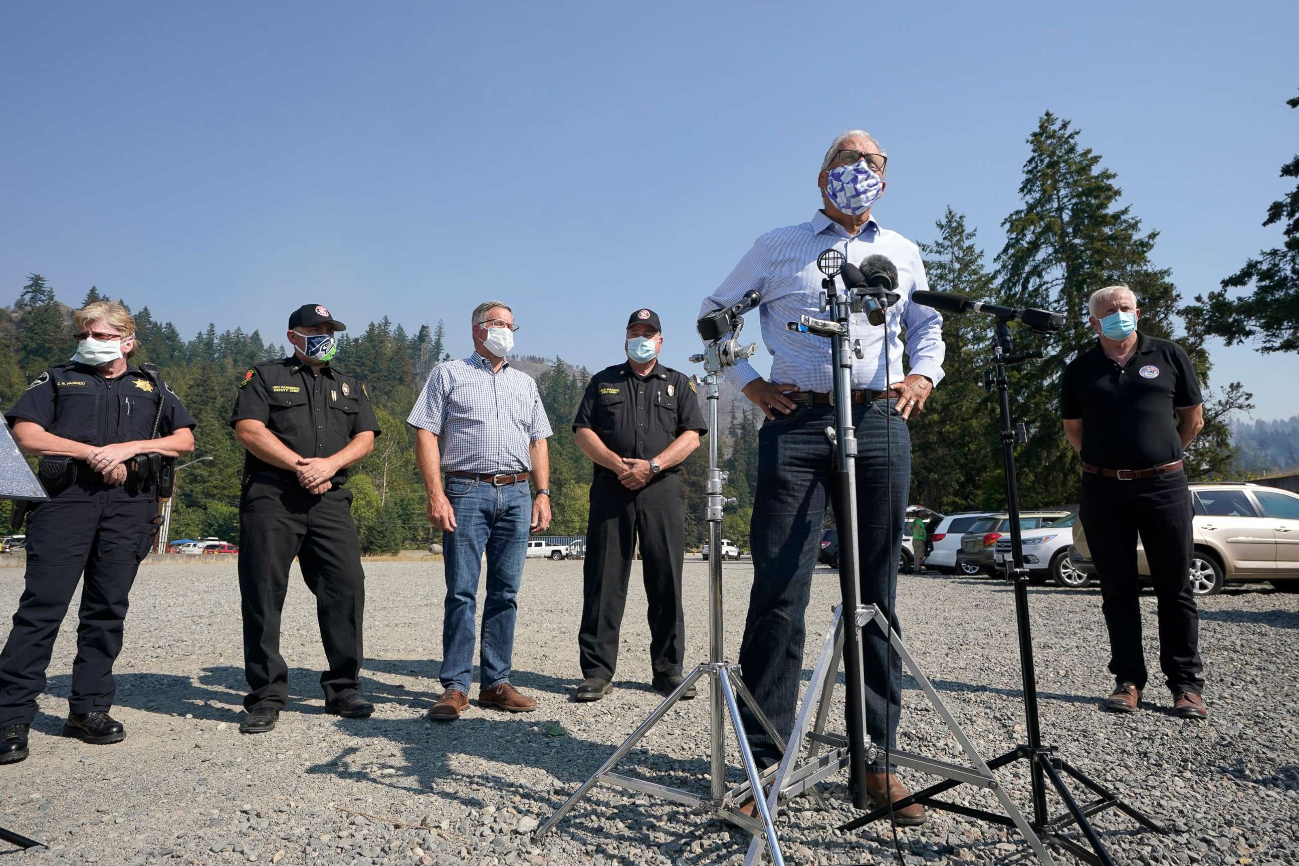 PHOTO: Washington Gov. Jay Inslee talks to reporters, Sept. 9, 2020, following a tour to survey wildfire damage in Bonney Lake, Wash., south of Seattle.