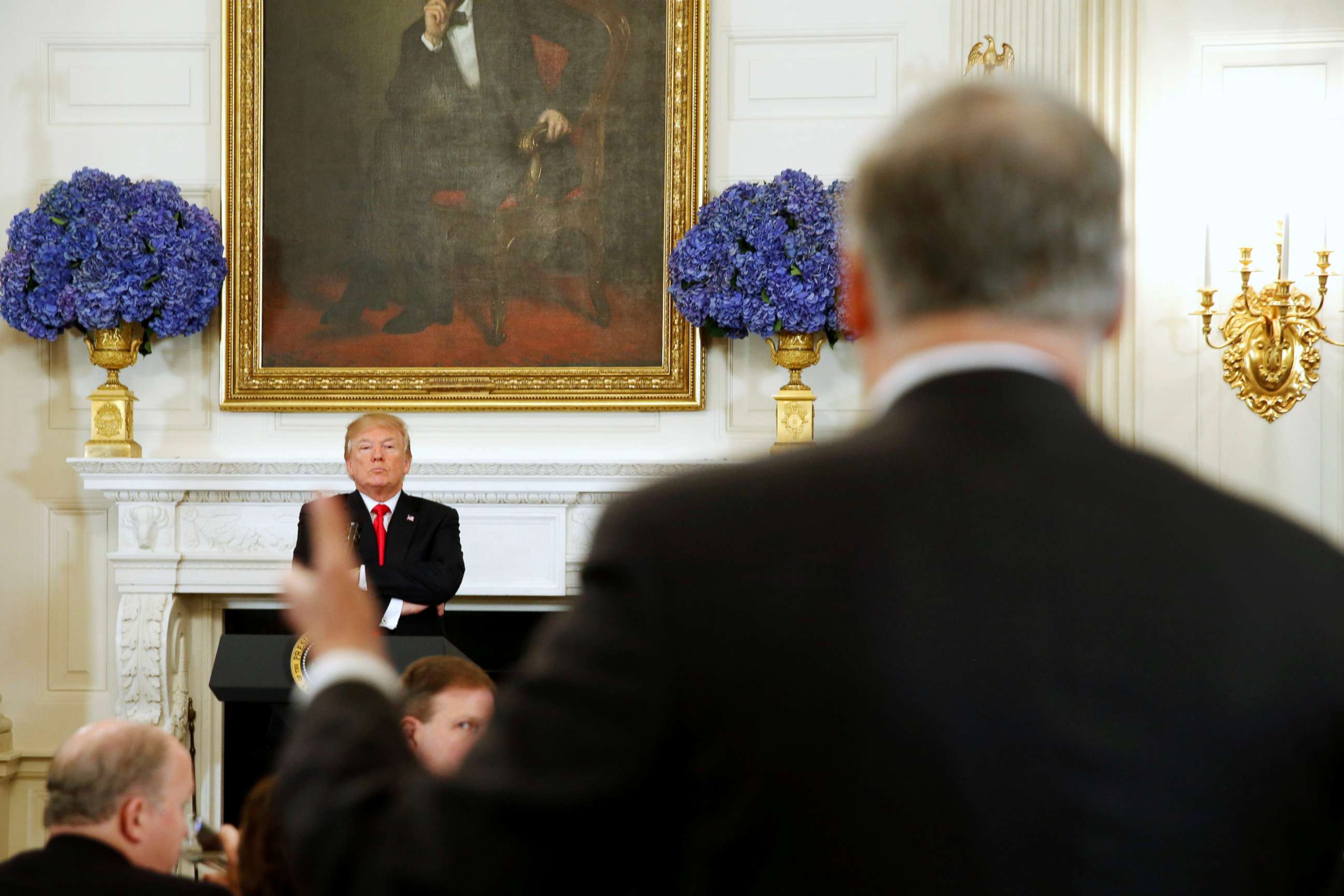 PHOTO: President Donald Trump looks on as Washington State Governor Jay Inslee (R) engages him during a discussion about school shootings with state governors from around the country at the White House, Feb. 26, 2018. 