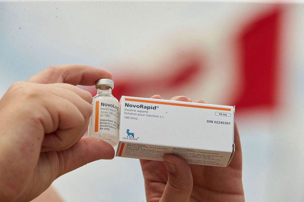 PHOTO: Allison Nimlos, of Minnesota, holds up her U.S. bottle of NovoLog insulin and a Canadian box of NovoRapid, which she picked up at a pharmacy in London, Ontario, Canada., June 29, 2019.  