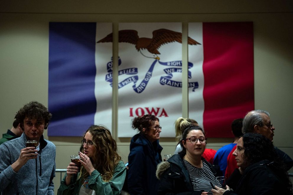 PHOTO: Supporters watch tv as they wait for the results during the Sen. Bernie Sanders Caucus Night Celebration at the Holiday Inn, Feb. 3, 2020, in Des Moines, Iowa. 