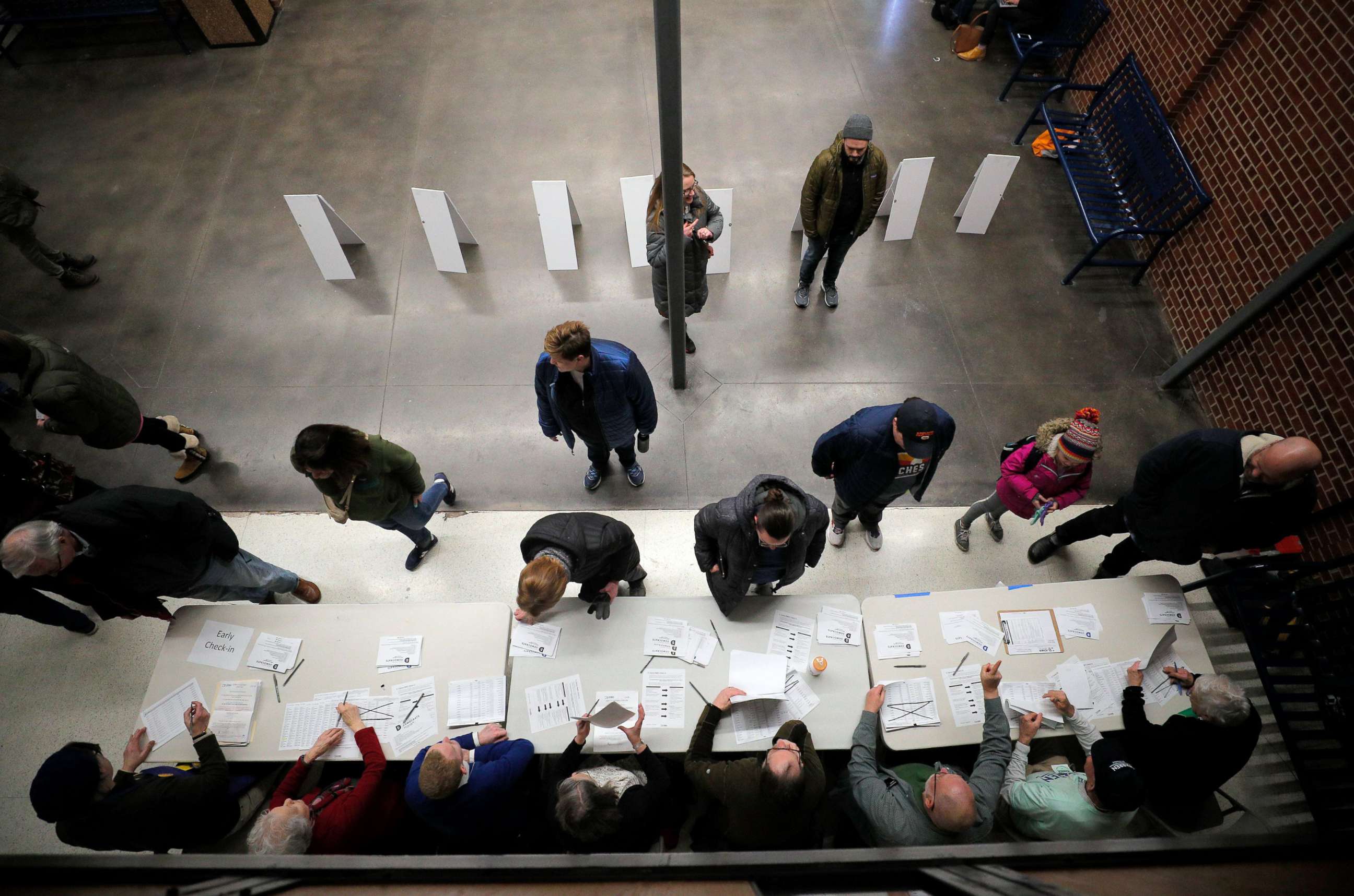 PHOTO: Caucus participants arrive to register in Des Moines, Iowa, Feb. 3, 2020.