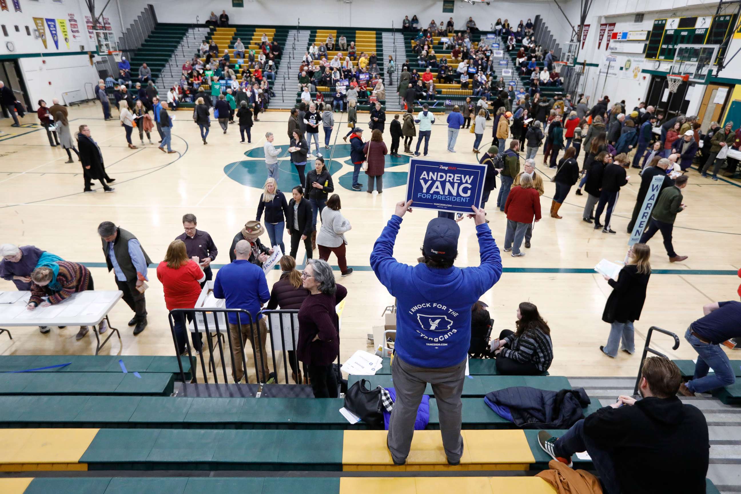 PHOTO: A supporter for Democratic presidential candidate Andrew Yang waits in the stands before a Democratic caucus at Hoover High School, Feb. 3, 2020, in Des Moines, Iowa.