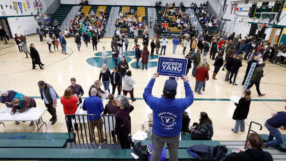 PHOTO: A supporter for Democratic presidential candidate Andrew Yang waits in the stands before a Democratic caucus at Hoover High School, Feb. 3, 2020, in Des Moines, Iowa.