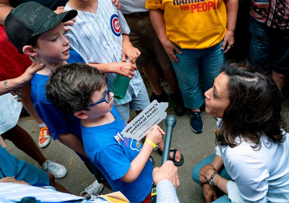 PHOTO: Democratic presidential candidate Kamala Harris speaks with children at the Iowa State Fair on August 10, 2019 in Des Moines, Iowa.