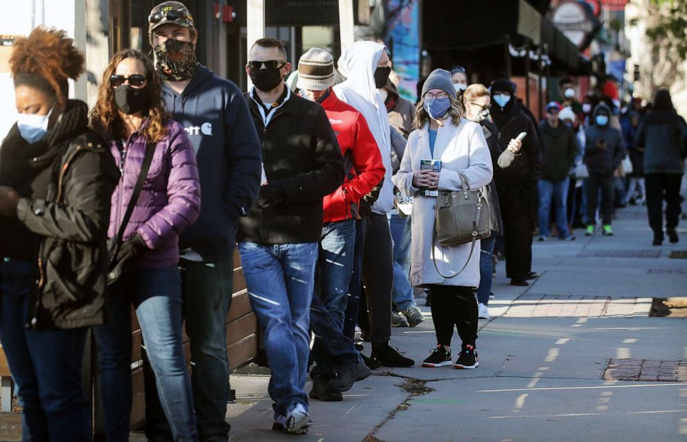 PHOTO: Voters wait in line to cast their ballots during early voting in the final days of the 2020 presidential election on Oct. 30, 2020 in Des Moines, Iowa.