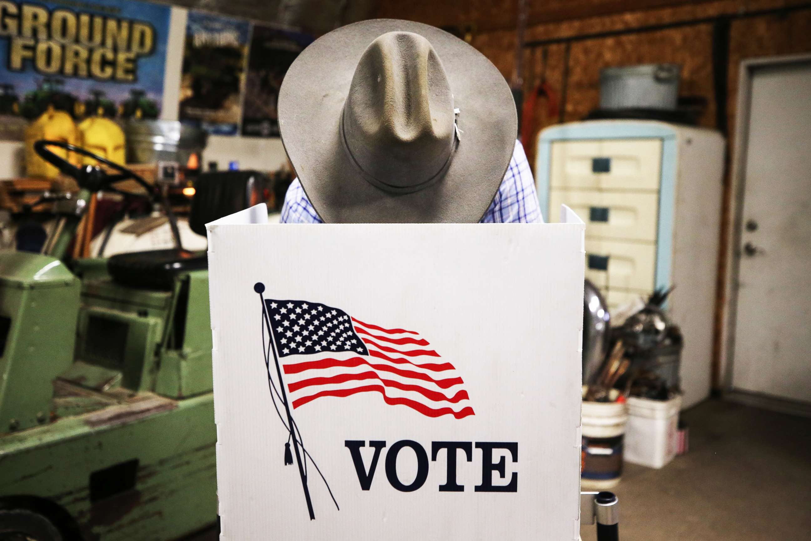 PHOTO: A voter marks his ballot at a polling place in Dennis Wilkening's shed on November 3, 2020 in Richland, Iowa.