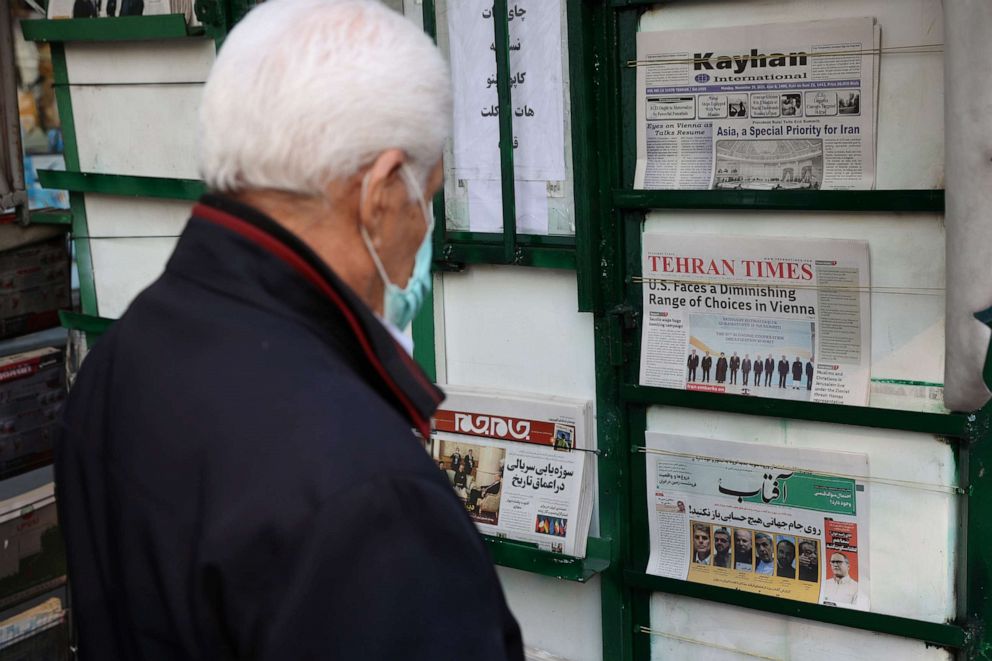 PHOTO: A man looks at newspapers on display in Tehran, Iran, Nov. 29, 2021.