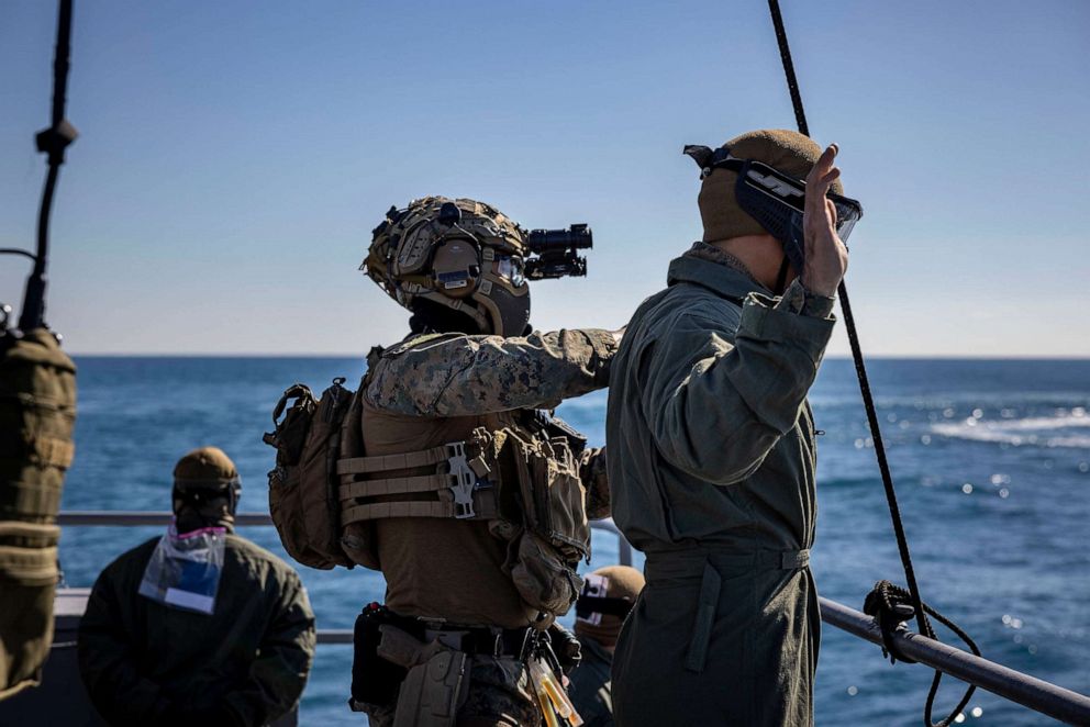 PHOTO: A U.S. Marine with the 26th Marine Expeditionary Unit (MEU), searches a hostage during a visit, board, search, and seizure training mission in support of Amphibious Squadron/MEU Integrated Training (PMINT), in the Atlantic Ocean Jan. 27, 2023.