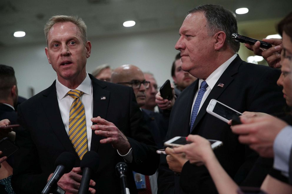 PHOTO: Acting U.S. Defense Secretary Patrick Shanahan, left, speaks to members of the media as Secretary of State Mike Pompeo listens, May 21, 2019, on Capitol Hill in Washington.