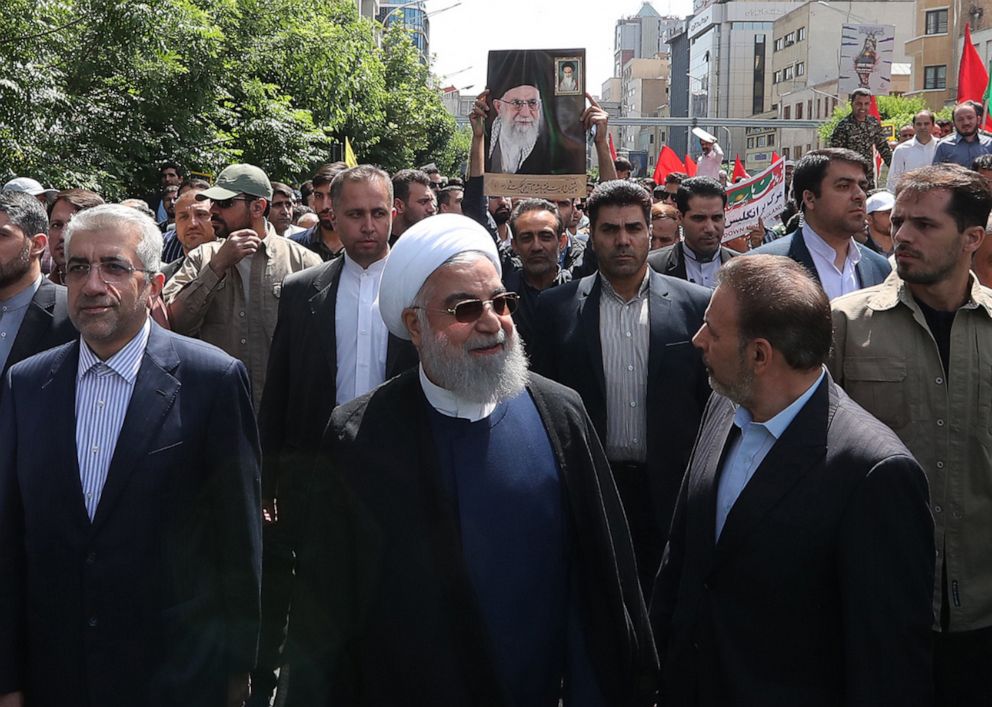 PHOTO: A handout picture provided by the presidential office shows Iranian President Hassan Rouhani (C) attending a parade marking al-Quds (Jerusalem) International Day in Tehran on May 31, 2019.