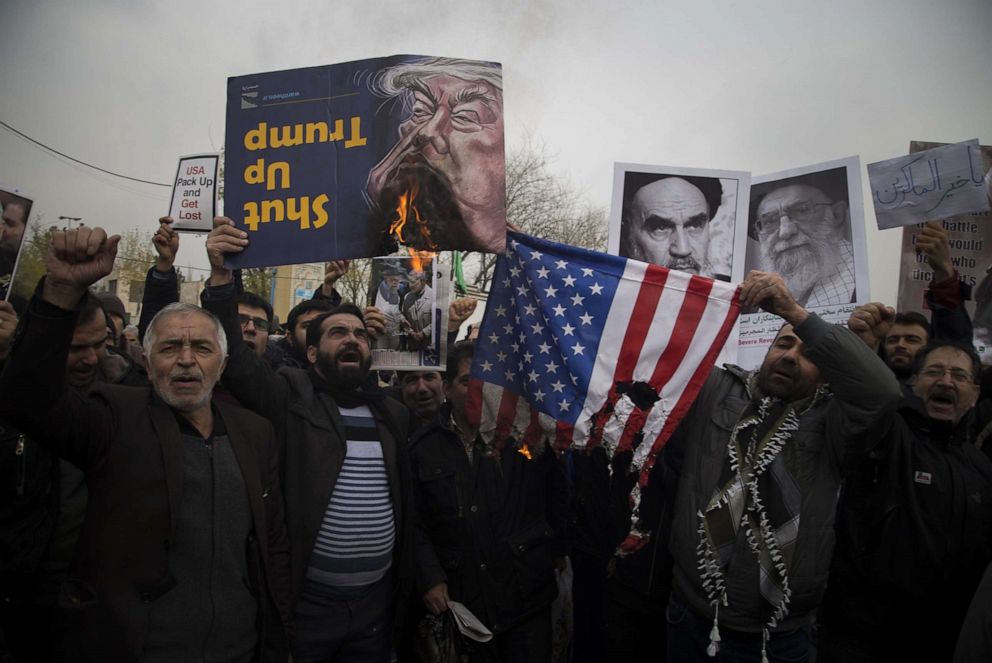 PHOTO: In this Jan. 17, 2020, file photo, regime supporters burn the US flag during a protest in Tehran.