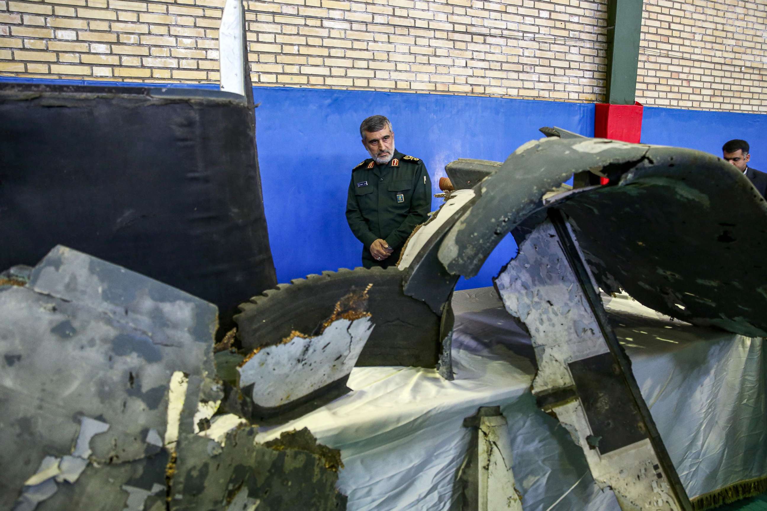 PHOTO: General Amir Ali Hajizadeh, Iran's Head of the Revolutionary Guard's aerospace division, looks at debris from a downed U.S. drone reportedly recovered within Iran's territorial waters, June 21, 2019, in Tehran.