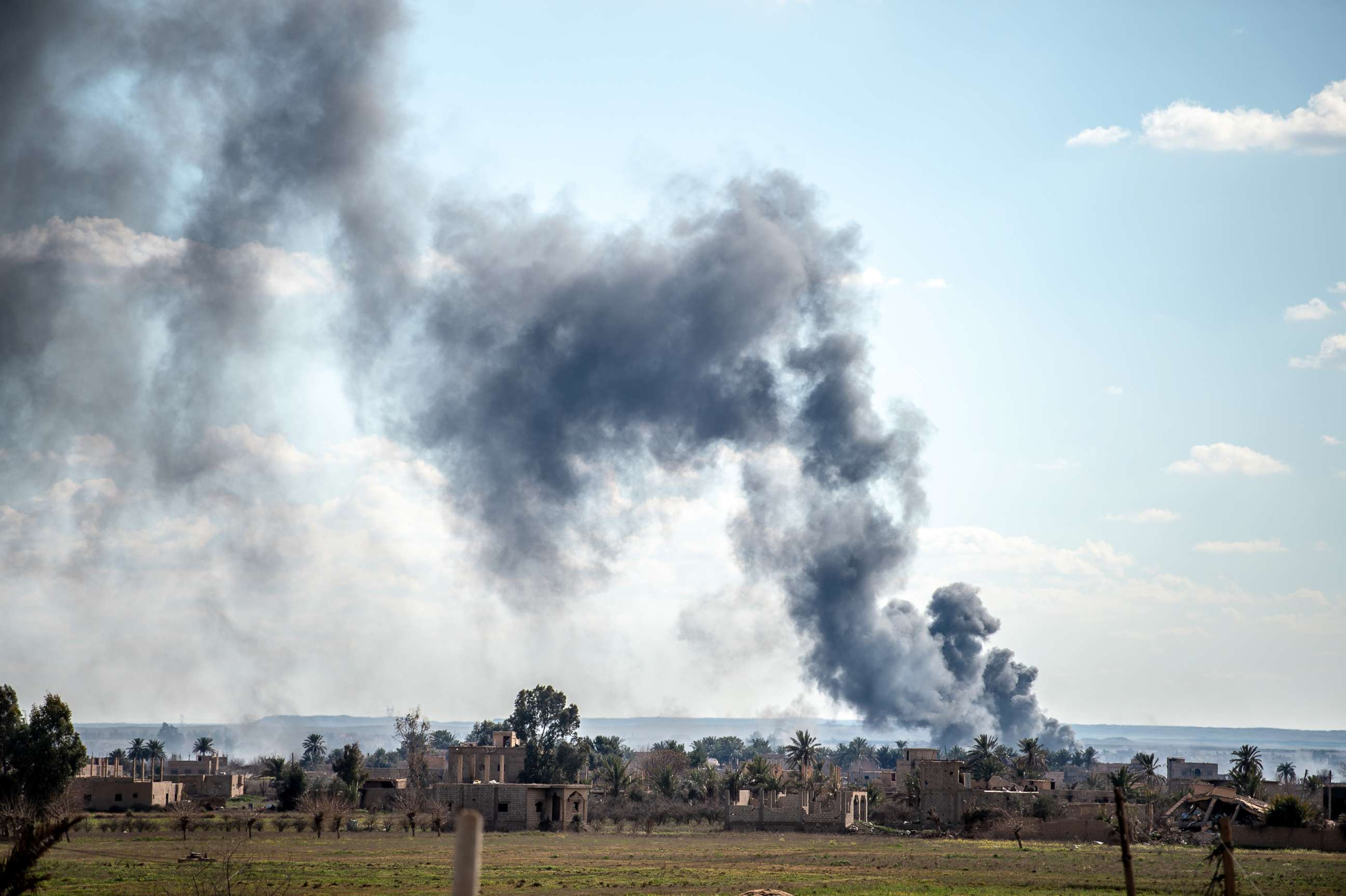 PHOTO: Smoke billows after shelling on the Islamic State group's last holdout of Baghouz, in the eastern Syrian Deir Ezzor province on March 3, 2019.
