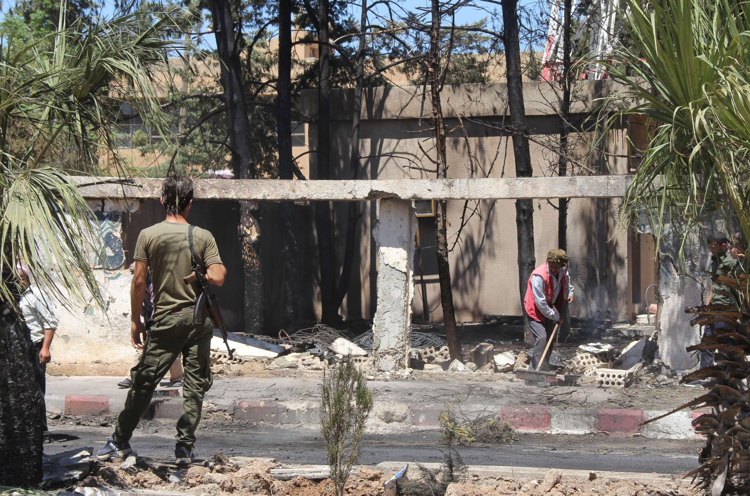 PHOTO:A member of the Kurdish security stands guard at the site of a explosive-rigged vehicle that detonated in the town of al-Qahtaniyah, in the Hasakeh province on August 7, 2019.