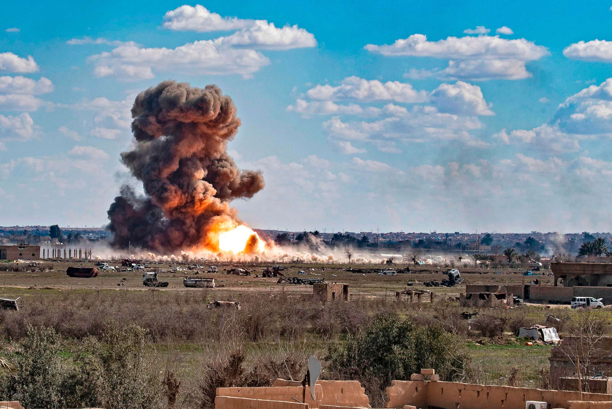 PHOTO: Smoke and fire billow after shelling on the Islamic State group's last holdout of Baghouz, in the eastern Syrian Deir Ezzor province, March 3, 2019. 