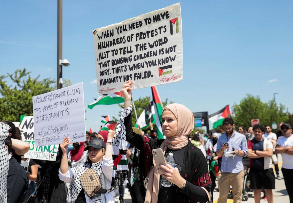 PHOTO: A woman holds a sign during a pro-Palestinian protest in Dearborn, Mich., May 18, 2021.