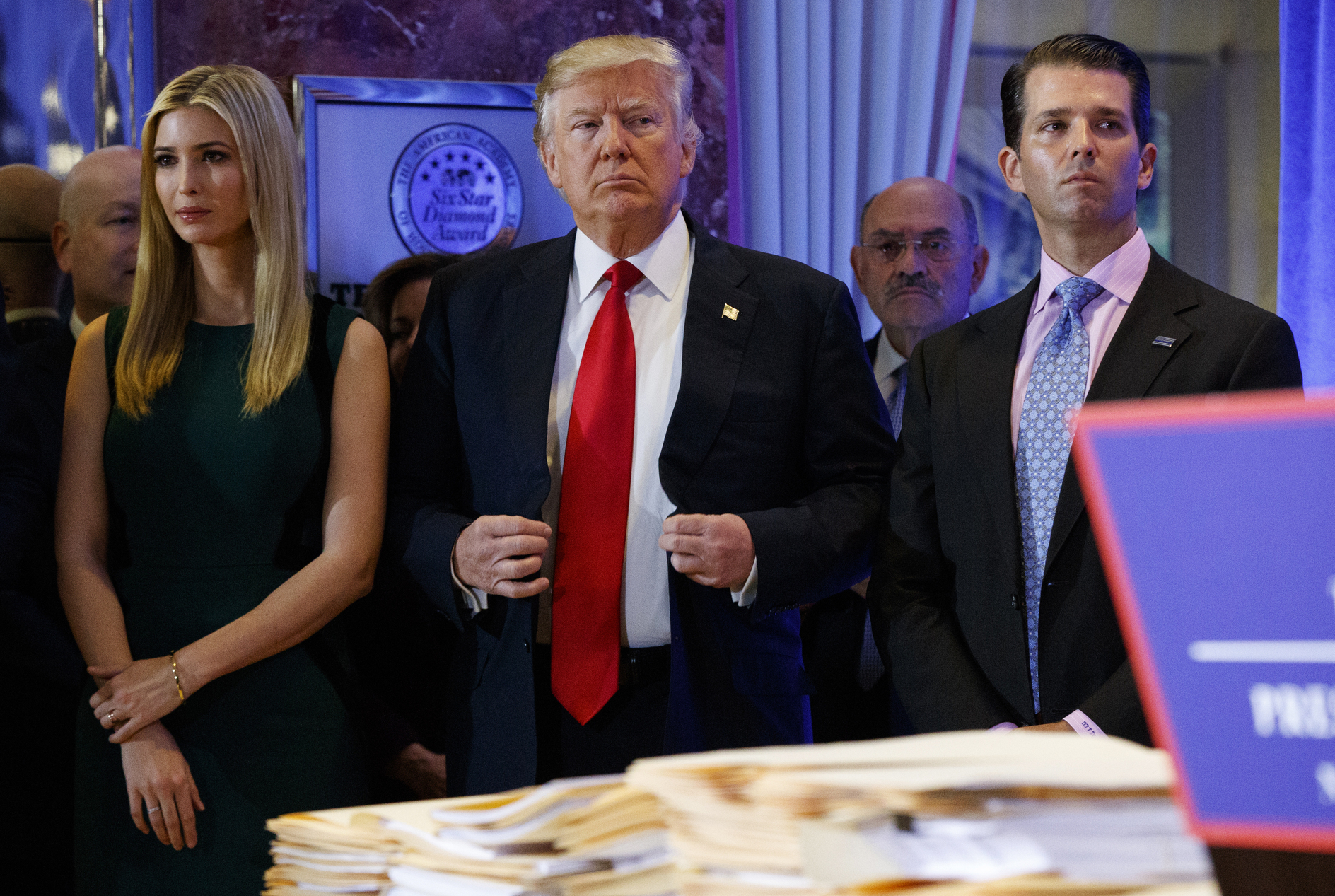 PHOTO: In this Jan. 11, 2017, photo, President-elect Donald Trump, center, stands next to Allen Weisselberg, second from left, Donald Trump Jr., right and Ivanka Trump, left, at a news conference in the lobby of Trump Tower in New York.