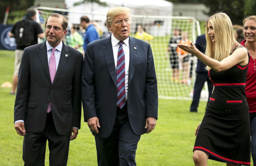 PHOTO: President Donald Trump, Health and Human Services Secretary Alex Azar and Ivanka Trump walk as they watch young participants during the White House Sports and Fitness Day on the South Lawn on May 30, 2018, in Washington, D.C.