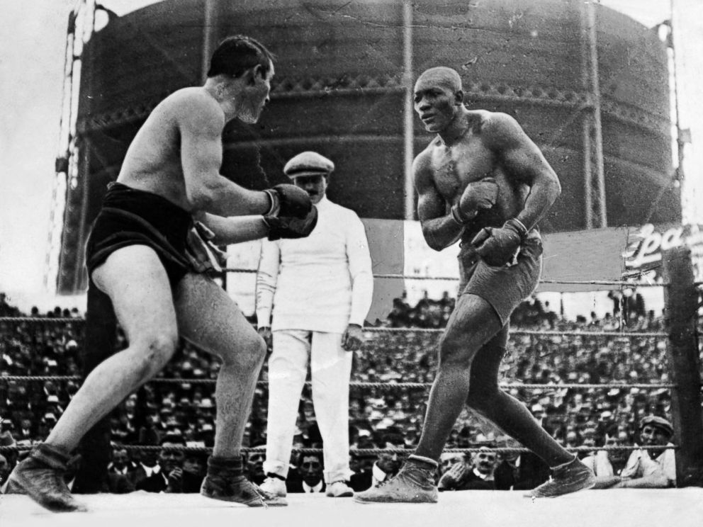 PHOTO: Open air Heavyweight World Championship fight between the reigning world champion Tommy Burns of Canada, left, and challenger Jack Johnson in front of 20,000 spectators at Rushcutters Bay near Sydney in 1908.