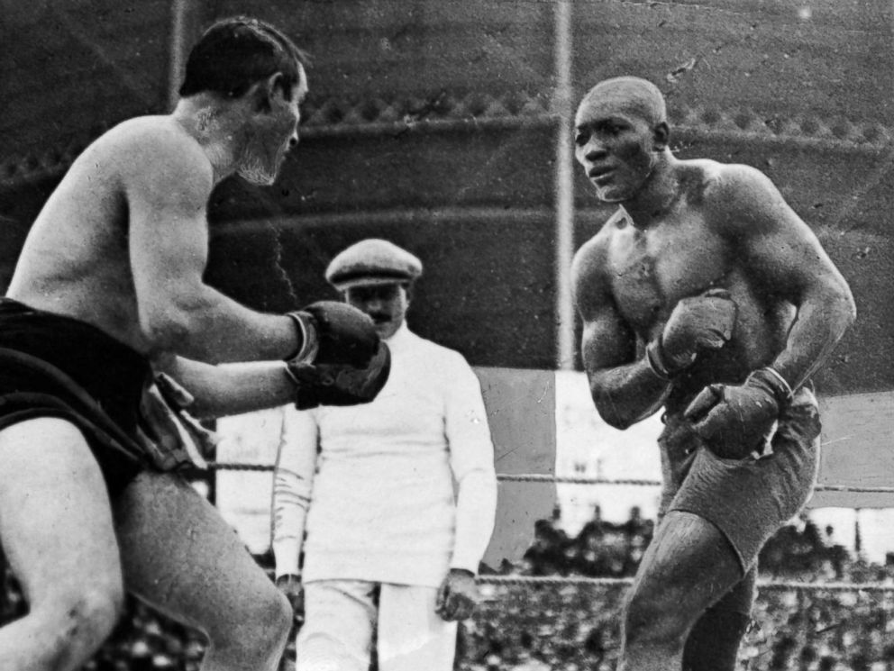 PHOTO: Open air Heavyweight World Championship fight between the reigning world champion Tommy Burns of Canada, left, and challenger Jack Johnson in front of 20,000 spectators at Rushcutters Bay near Sydney in 1908.
