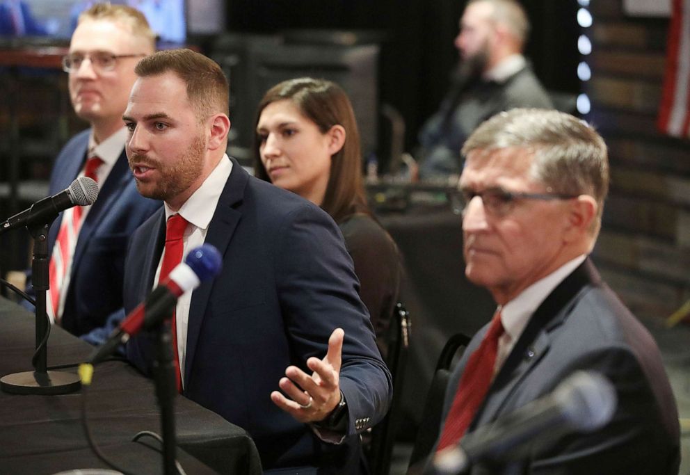 PHOTO: Pastor Jackson Lahmeyer speaks at an event to announce his run for the U.S. Senate, March 16, 2021 in Jenks, Okla., while President Donald Trump's former national security advisor Michael Flynn sits by his side.