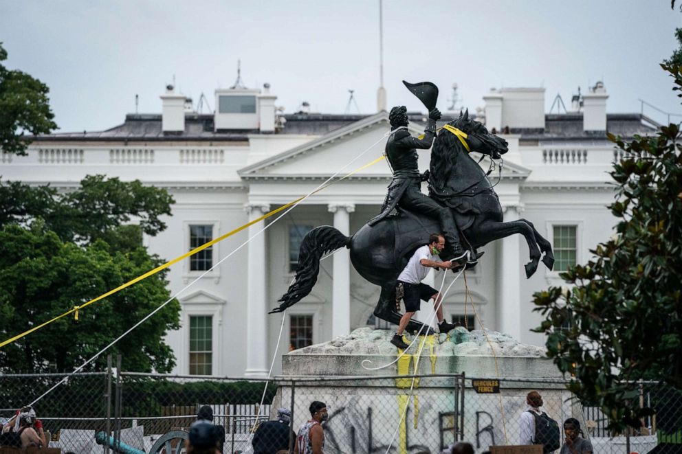 PHOTO: Protesters attempt to pull down the statue of Andrew Jackson in Lafayette Square near the White House on June 22, 2020 in Washington, DC.