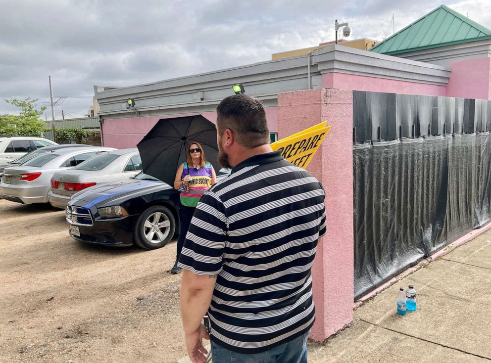 PHOTO: Keith Dalton, a pastor and father of five, protests against abortion outside Jackson Women's Health Organization as clinic volunteer Kim Gibson prepares to escort patients inside.