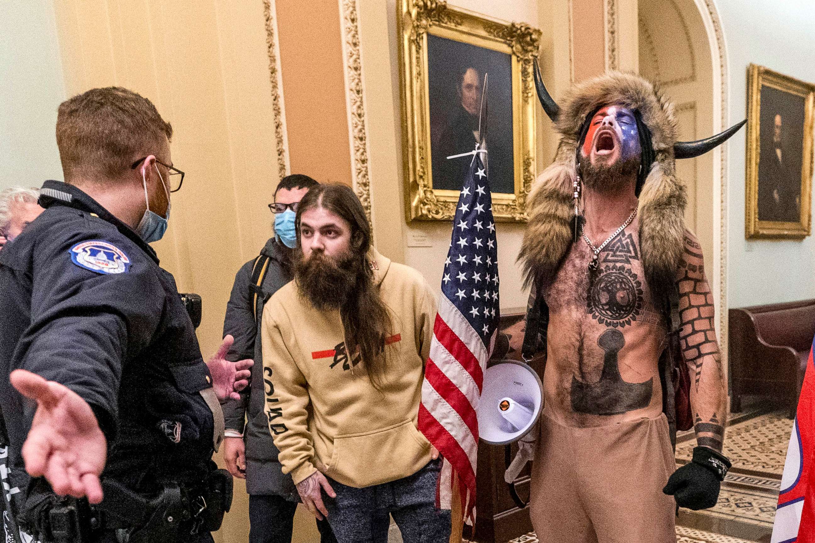 PHOTO: FILE - In this Jan. 6, 2021 file photo, supporters of President Donald Trump, including Jacob Chansley, right with fur hat, are confronted by U.S. Capitol Police officers outside the Senate Chamber inside the Capitol in Washington.