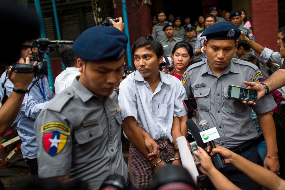 PHOTO: Police escort detained Myanmar journalist Kyaw Soe Oo after appearing before a court trial in Yangon, Myanmar, Aug. 20, 2018.