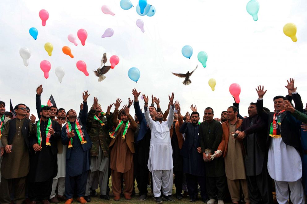 PHOTO: Youth release balloons and pigeons as they celebrate the reduction in violence, in Jalalabad, Afghanistan, Feb. 28, 2020.