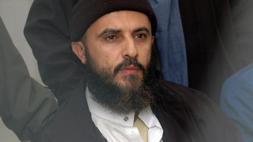 Yemeni convict Jamal al-Badawi listens to the verdict being announced from behind the bars in a Sanaa appeals court, Feb. 26, 2005.