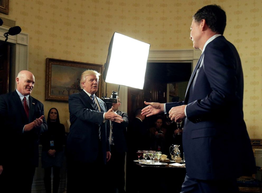 PHOTO: President Donald Trump greets Director of the FBI James Comey as Director of the Secret Service Joseph Clancy watches during the Inaugural Law Enforcement Officers and First Responders Reception at the White House in Washington, Jan. 22, 2017.