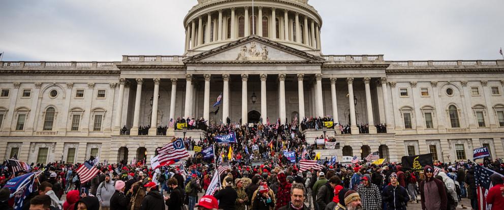 PHOTO: A large group of pro-Trump protesters stand on the East steps of the Capitol Building after storming its grounds, Jan. 6, 2021, in Washington.
