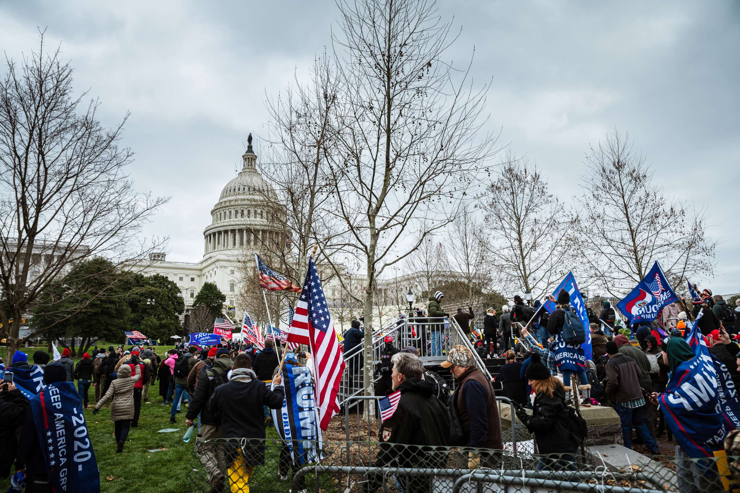 PHOTO: A large group of pro-Trump protesters overtake police and barriers in order to access the Capitol Building on January 6, 2021 in Washington, DC.