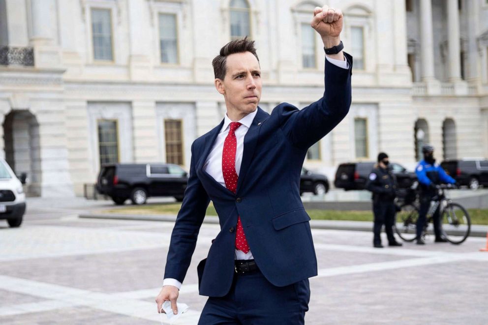PHOTO: Sen. Josh Hawley gestures toward a crowd of supporters of President Donald Trump gathered outside the U.S. Capitol to protest the certification of President-elect Joe Biden's electoral college victory Jan. 6, 2021.