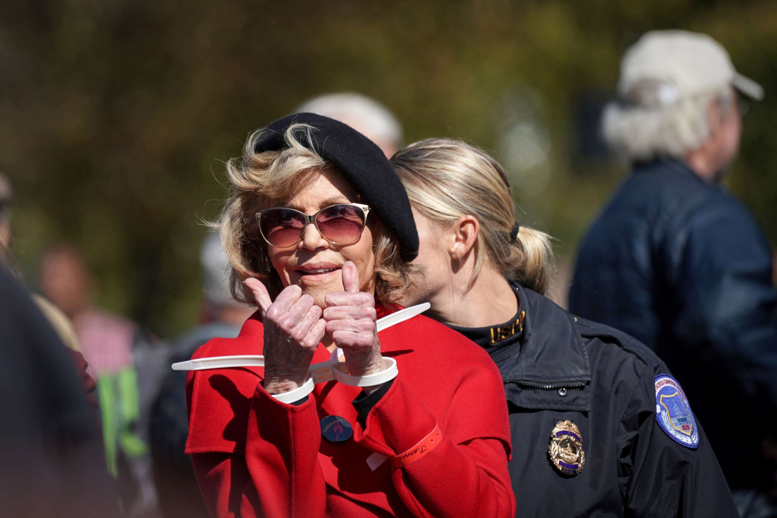 PHOTO: Actor and activist Jane Fonda gives a thumbs up in handcuffs as she is detained for blocking the street in front of the Library of Congress during the "Fire Drill Fridays" protest in Washington, Oct. 18, 2019.