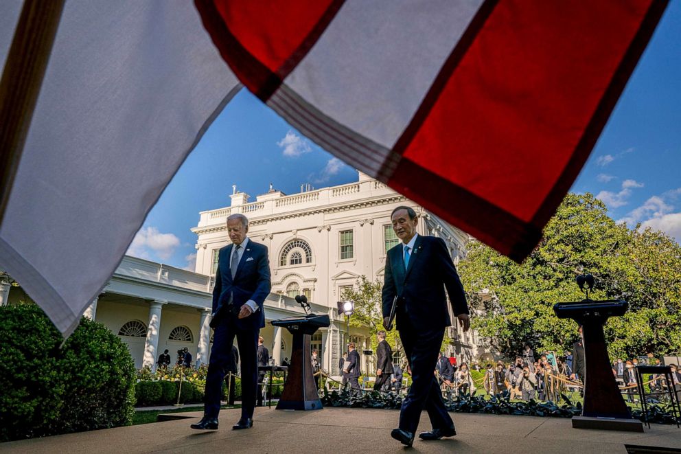 PHOTO: President Joe Biden and Japanese Prime Minister Yoshihide Suga leave a news conference in the Rose Garden of the White House, April 16, 2021. 