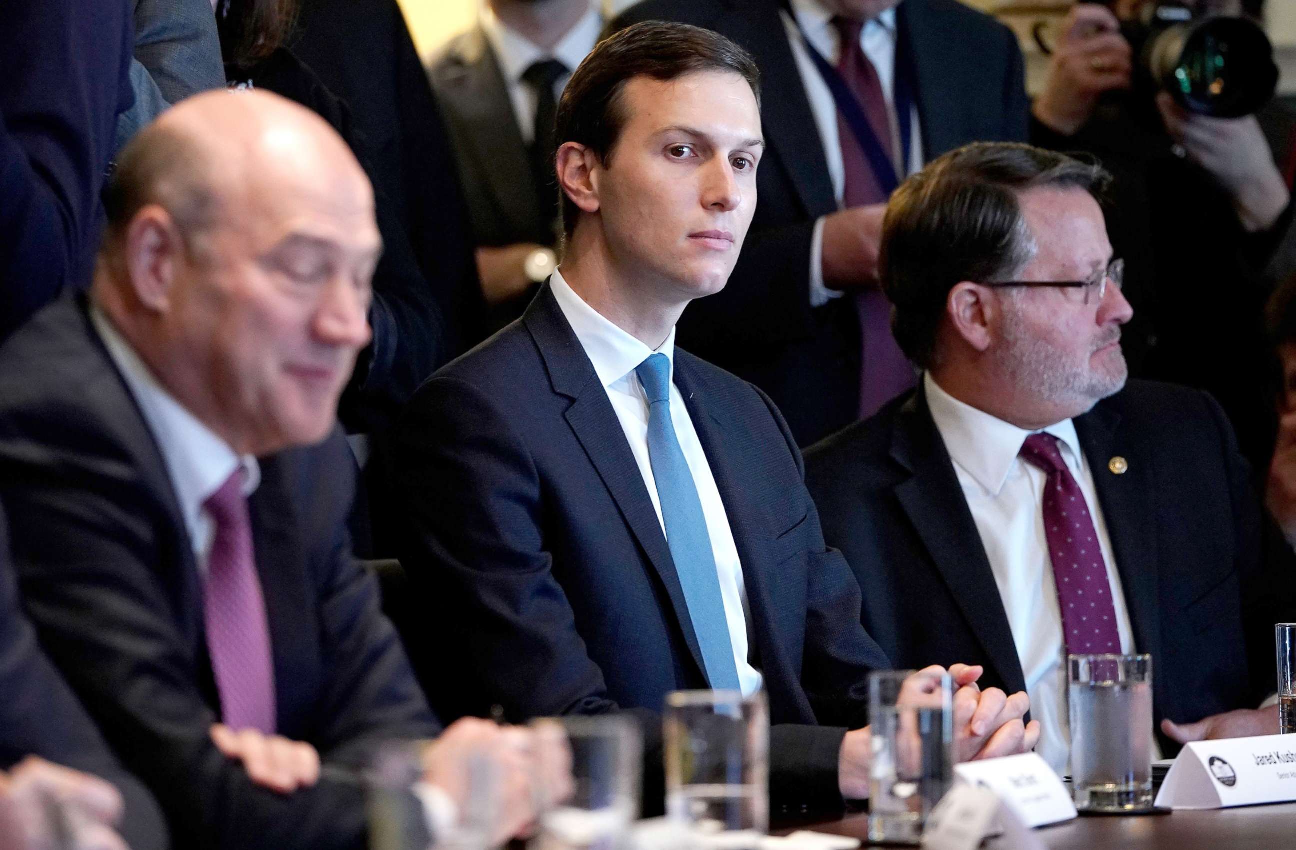 PHOTO: Director of the National Economic Council Gary Cohn, Senior Advisor Jared Kushner, and Sentor Gary Peters, D-MI, take part in a meeting with President Donald Trump and members of Congress on trade in the the White House, Feb. 13, 2018.