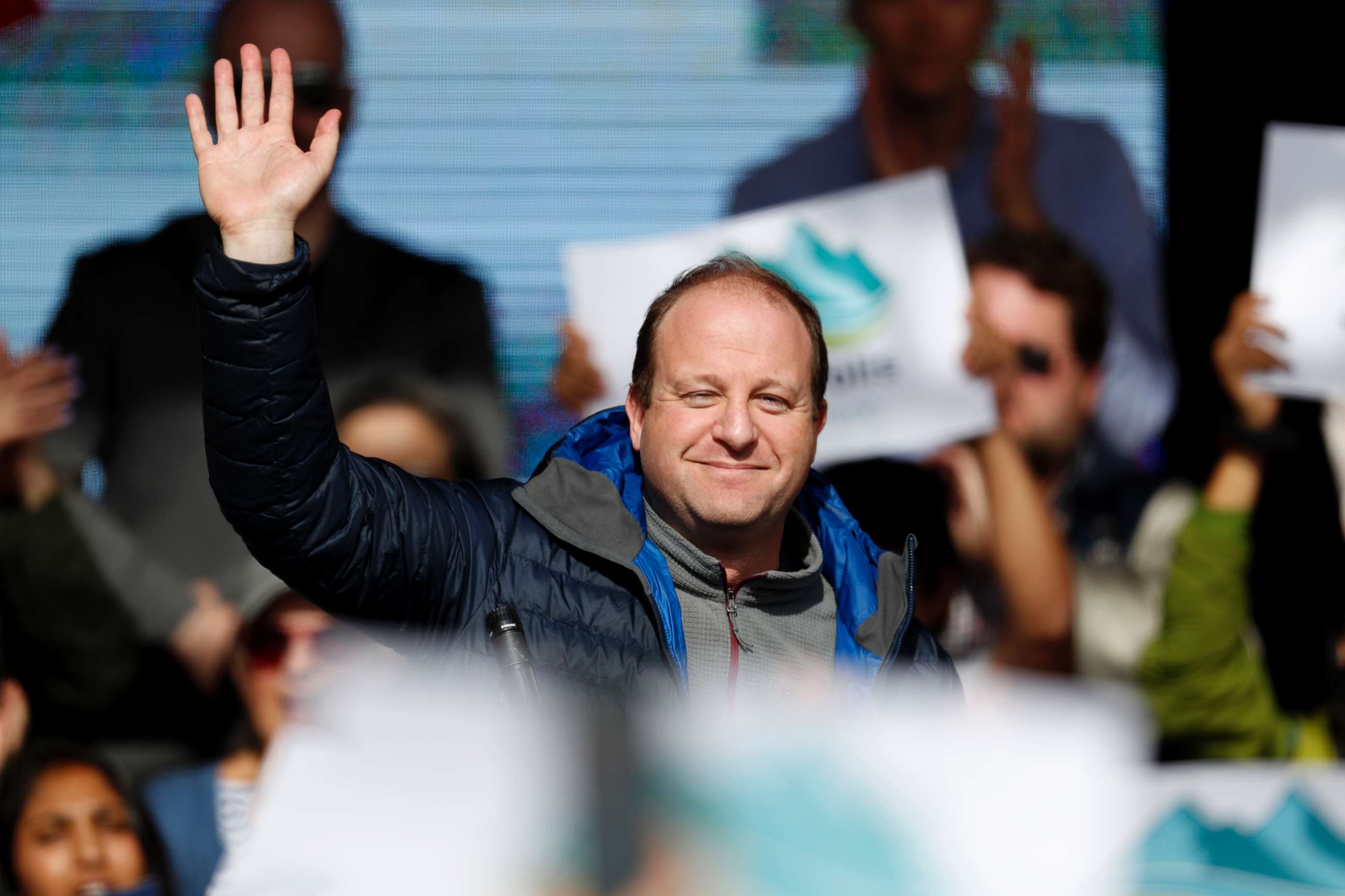 PHOTO: Jared Polis, Colorado's Democratic candidate for governor, waves to the crowd during a rally with young voters on the campus of the University of Colorado, Oct. 24, 2018, in Boulder, Colo.