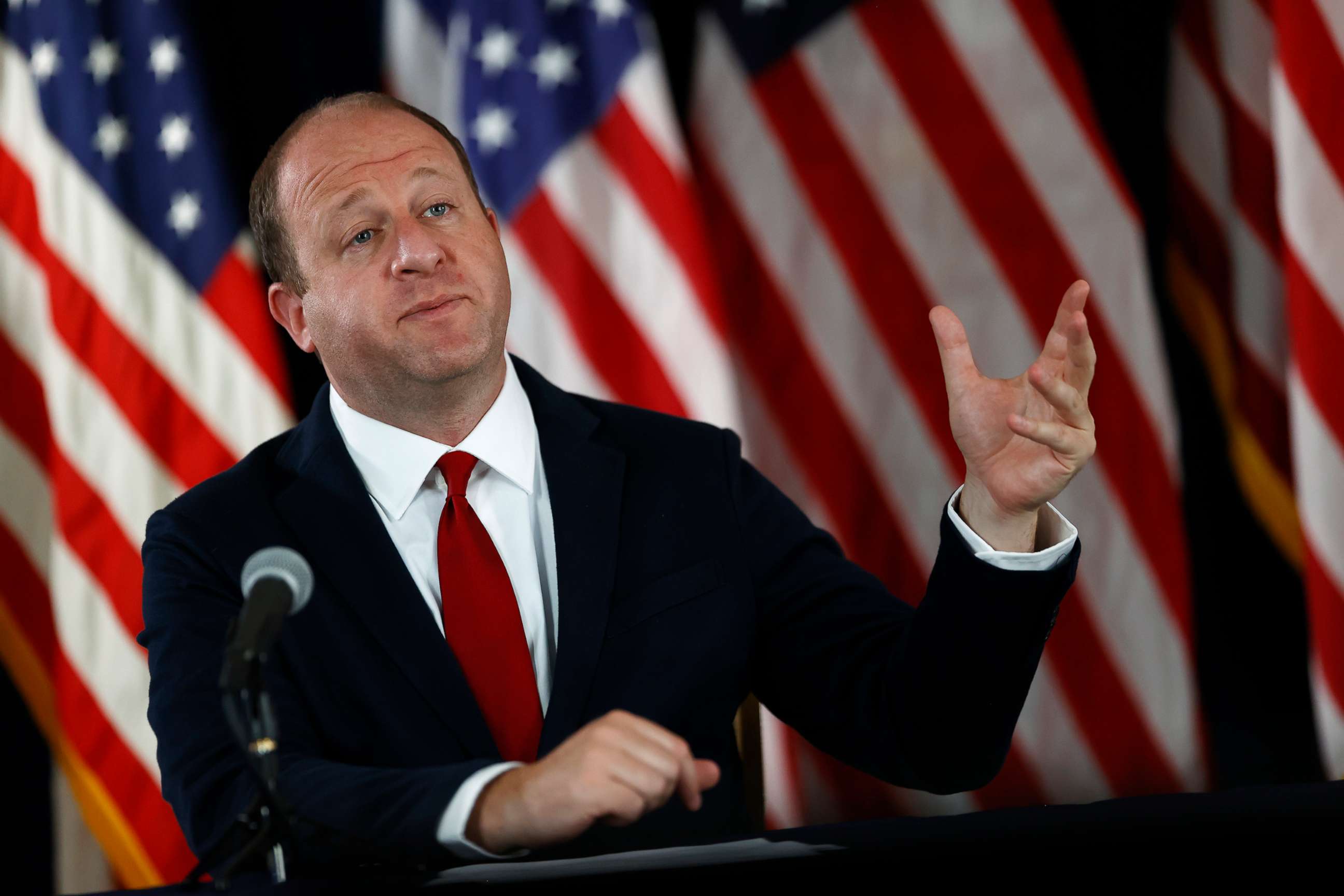 PHOTO: Colorado Governor Jared Polis makes a point during a news conference on the state's efforts to contain the spread of the new coronavirus, July 9, 2020, in Denver.