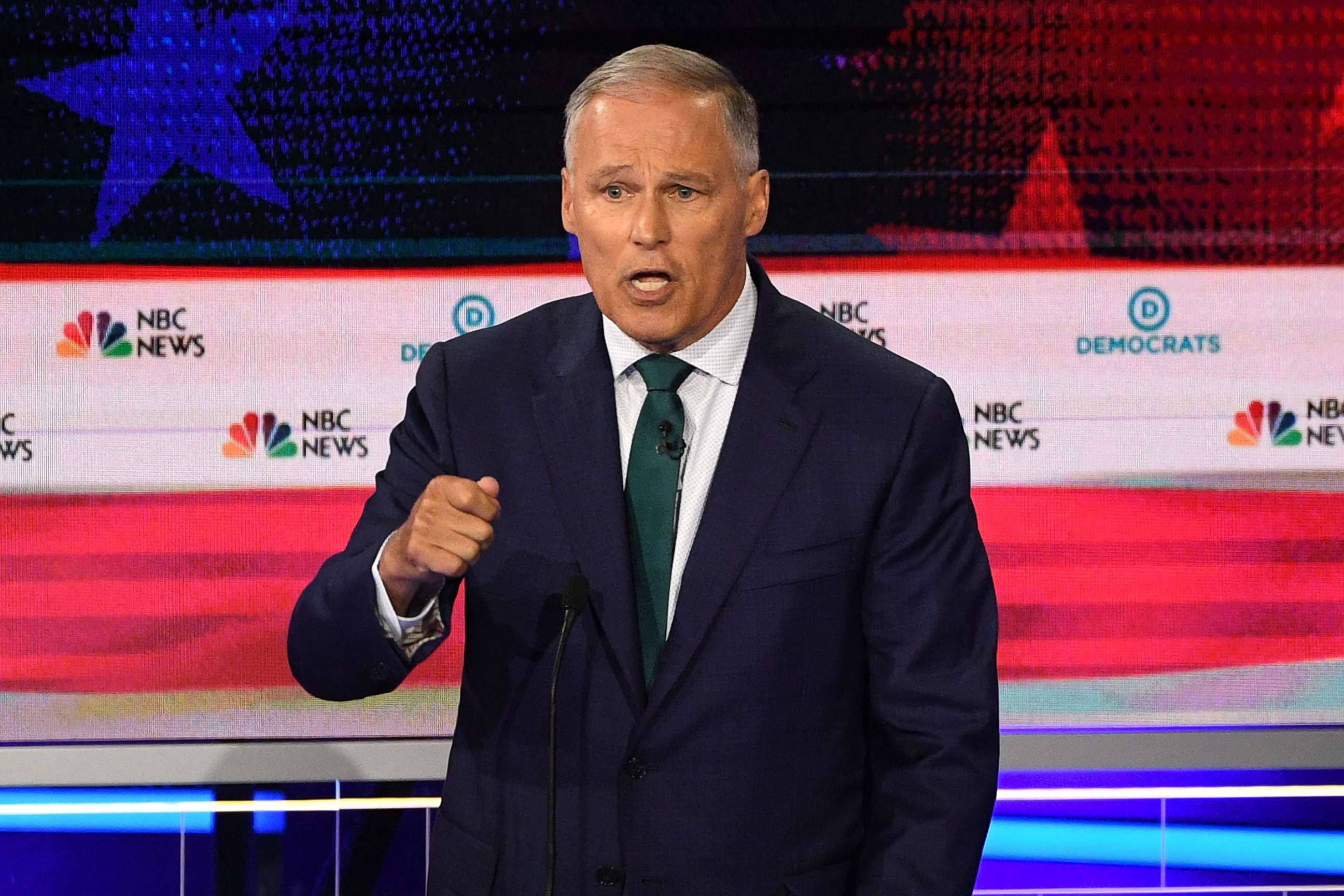PHOTO: Jay Inslee participates in the first Democratic primary debate hosted by NBC News at the Adrienne Arsht Center for the Performing Arts in Miami, Florida, June 26, 2019.