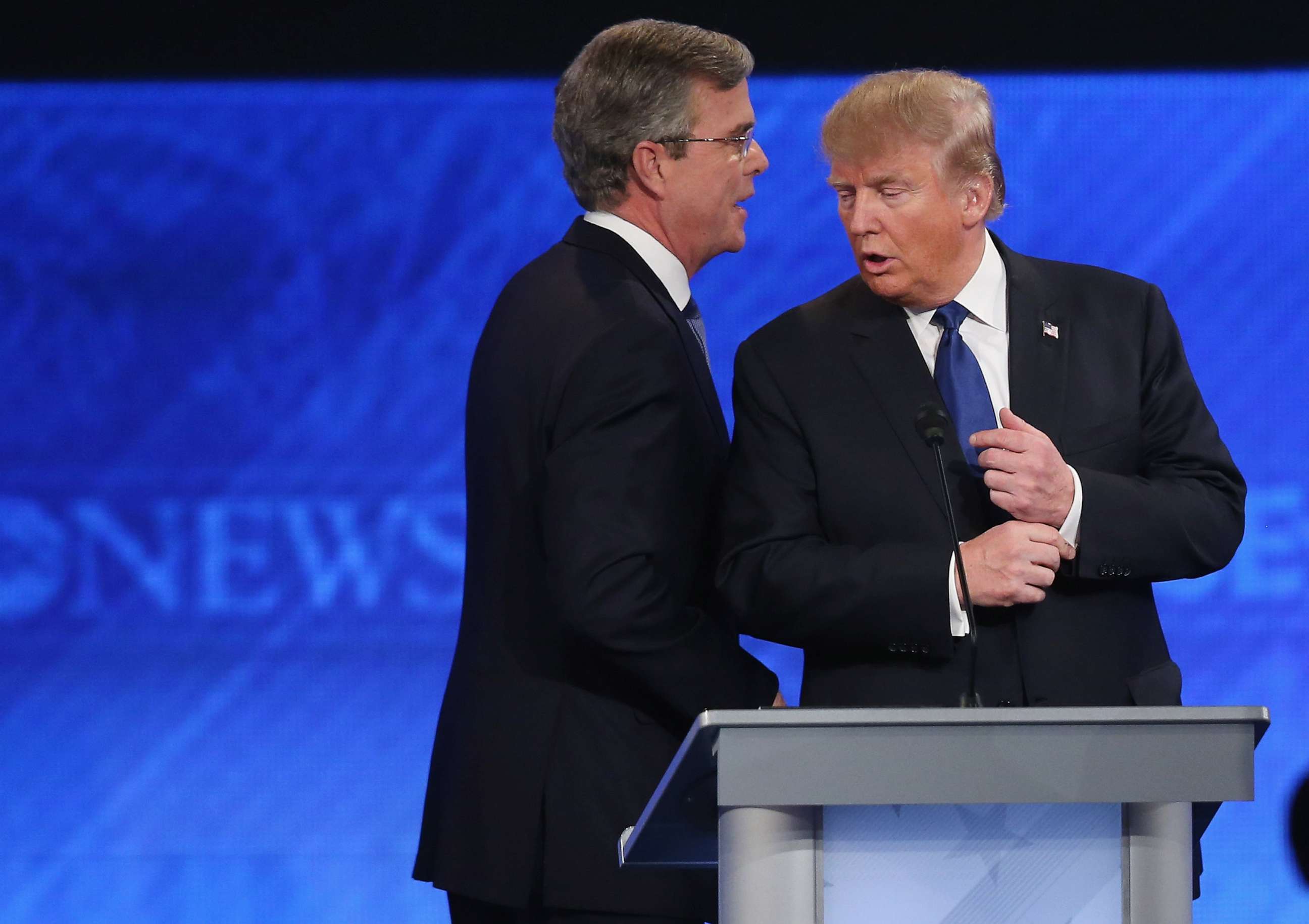 PHOTO: In this February 6, 2016 file photo Republican presidential candidates Jeb Bush and Donald Trump talk following the Republican presidential debate at St. Anselm College in Manchester, N.H.