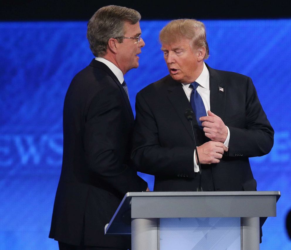 PHOTO: In this February 6, 2016 file photo Republican presidential candidates Jeb Bush and Donald Trump talk following the Republican presidential debate at St. Anselm College in Manchester, N.H.