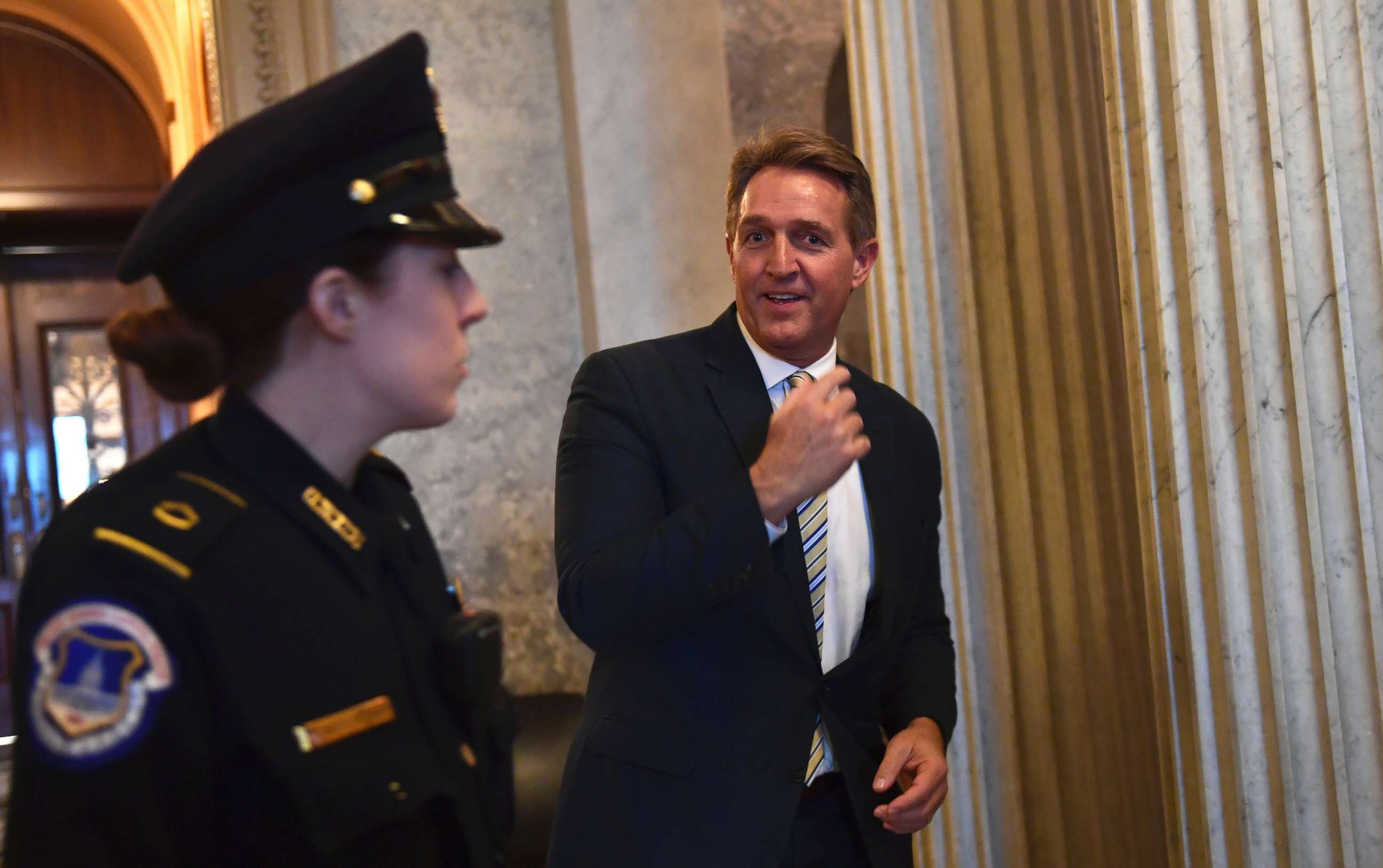 PHOTO: Sen. Jeff Flake walks on Capitol Hill on Dec. 5, 2017, following the weekly Republican policy luncheon.