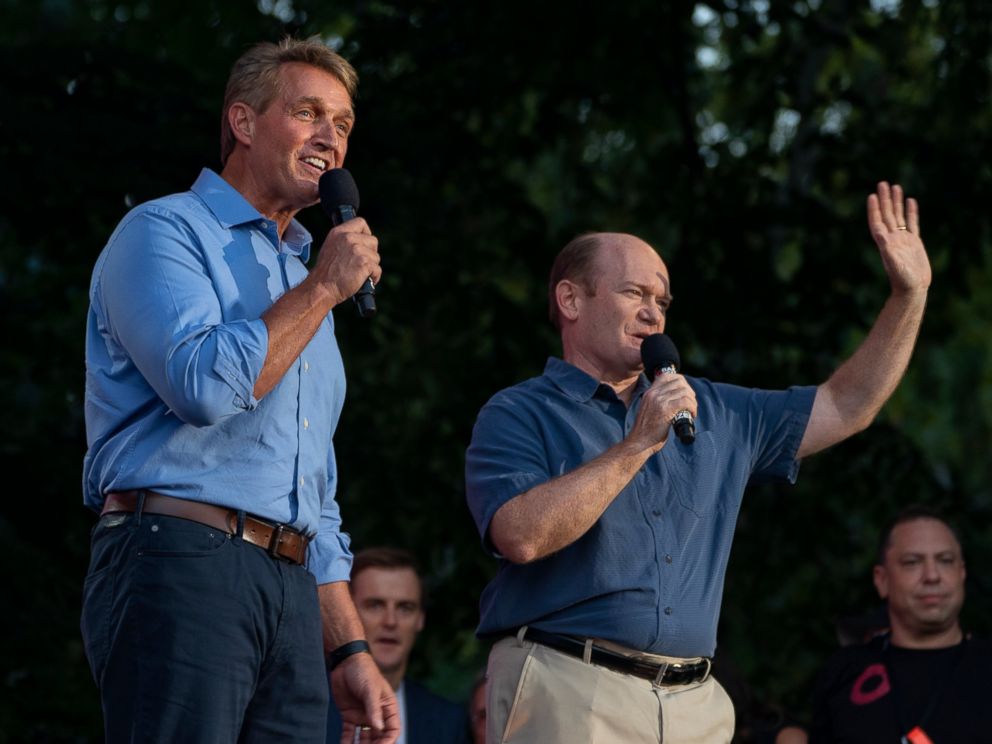 PHOTO: Jeff Flake, R-Ariz., left , and Sen. Chris Coons, D-Del, stand together as they address festival participants during the 2018 Global Citizen Festival Saturday, Sept. 29, 2018, in New York.